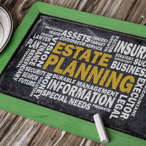 A chalkboard displays an estate planning word cloud concept - Donald Janklow Attorney at Law