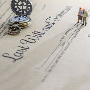 A tiny figure atop a lost will and testament document - Donald Janklow Attorney at Law